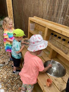 Children Playing with Sensory Items at Cadoxton Community Garden